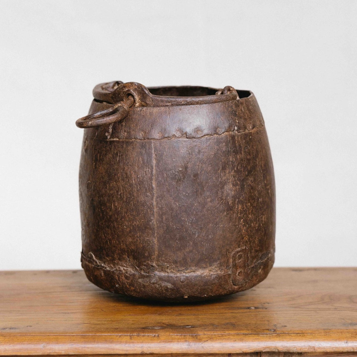 Vintage Indian iron planter with aged patina and ring handles, ideal for displaying orchids and indoor plants, exclusive to Brookfield Gardens.