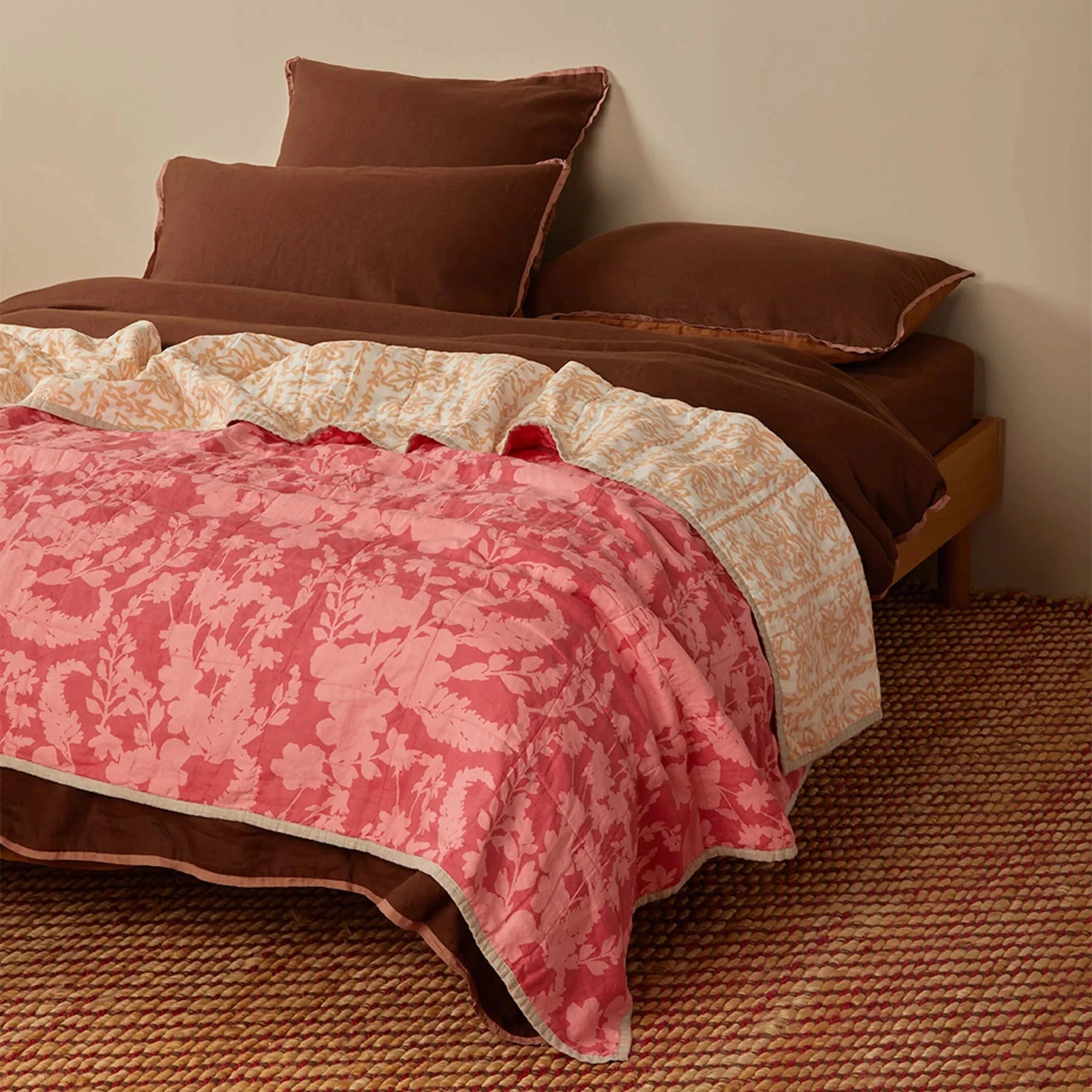 Bonnie and Neil Petal Pink & Daisy Buff linen quilted throw with reversible floral prints in soft pink and warm buff tones, crafted from stonewashed French flax linen.