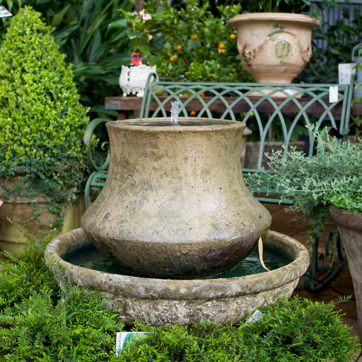 Tulip Fountain with Pump. Designed with a softly curved tulip-shaped form, this fountain creates a gentle bubbling water effect that adds movement and atmosphere to outdoor spaces.