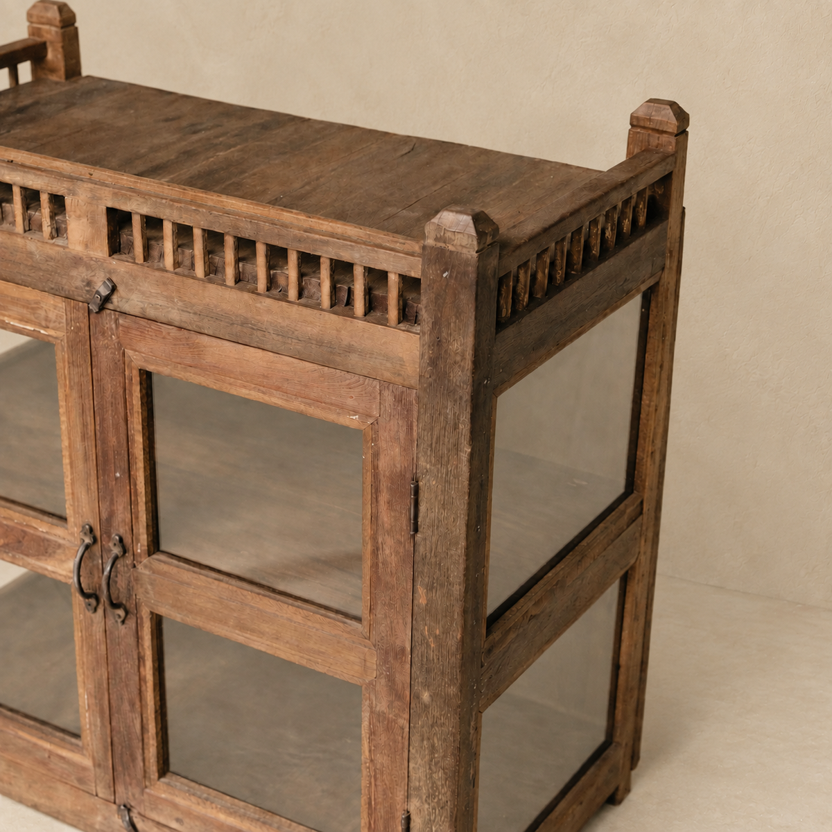 Vintage wooden glass cabinet from India with double doors and internal shelves, ideal for home storage and displaying ceramics and collected objects, exclusive to Brookfield Gardens.
