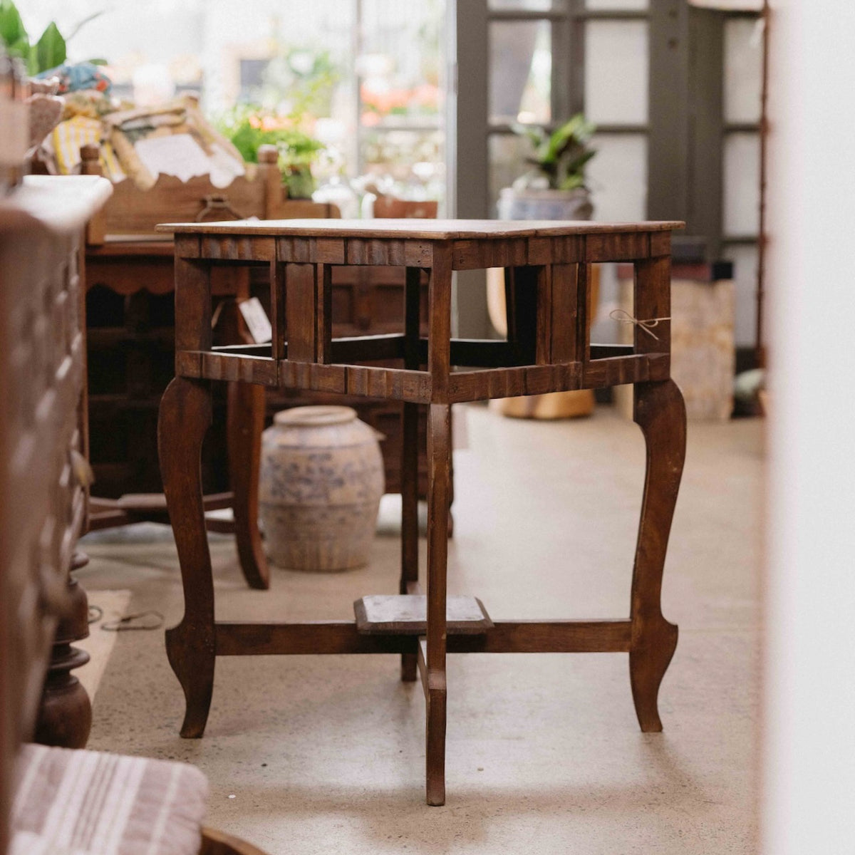 Vintage wooden side table from India with curved legs and decorative timber detail, ideal beside a sofa, armchair or bed, exclusive to Brookfield Gardens.