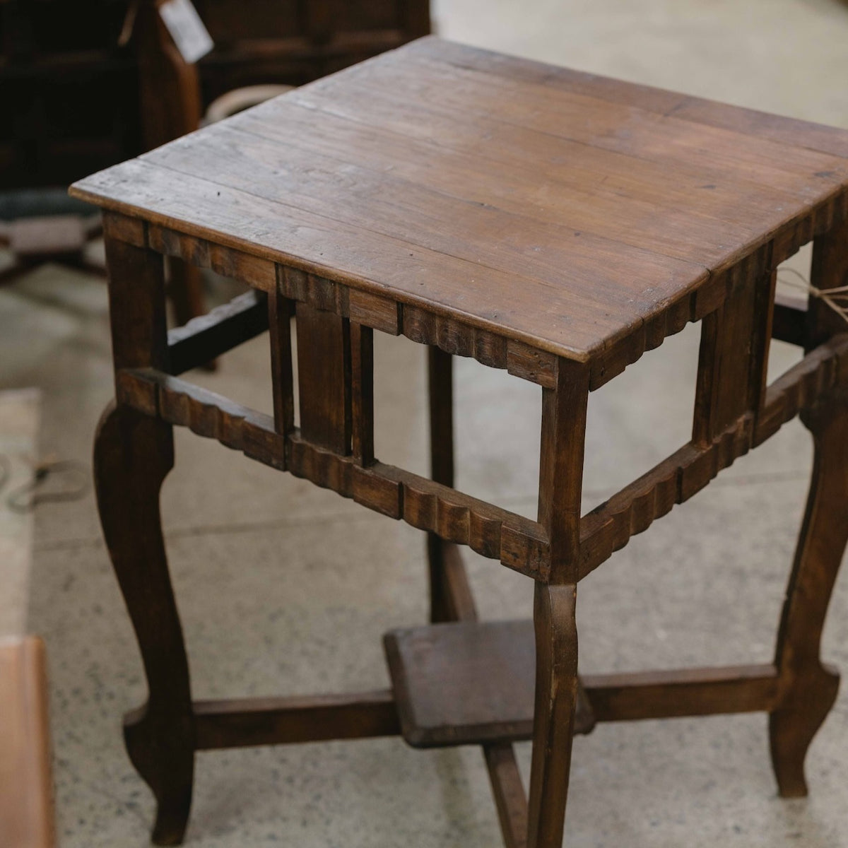 Vintage wooden side table from India with curved legs and decorative timber detail, ideal beside a sofa, armchair or bed, exclusive to Brookfield Gardens.