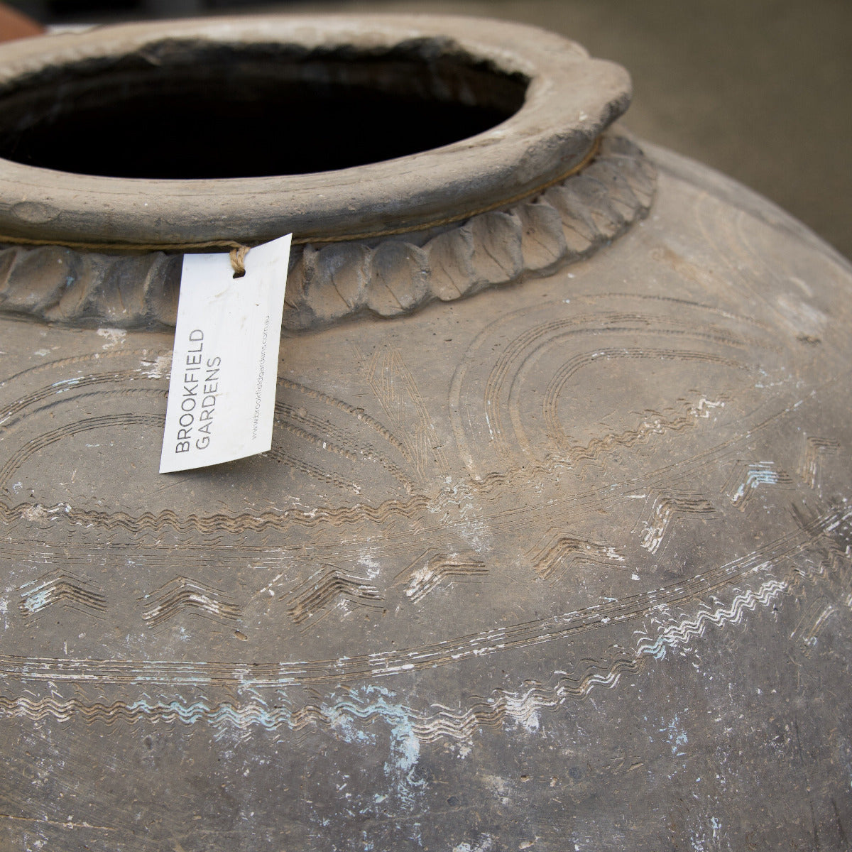 Large vintage Indian terracotta urn with rounded form, decorative rim and naturally weathered earthy finish, exclusive to Brookfield Gardens.