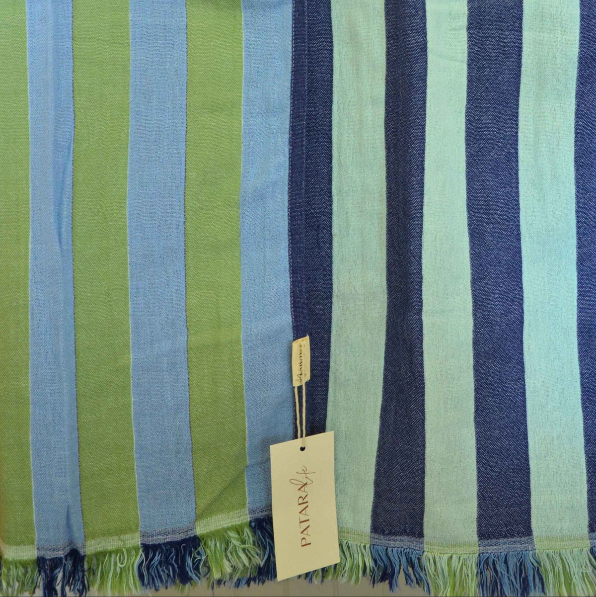 Patara Life Viva Stripe Turkish Beach Towel featuring colourful reversible stripes and fringed edges, made from 100% Turkish cotton.