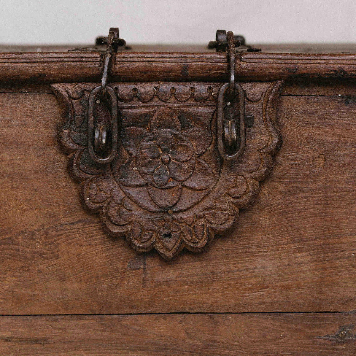 Vintage Indian wooden coffee table with lock, carved floral detail, iron hardware and hidden storage, exclusive to Brookfield Gardens Brisbane.