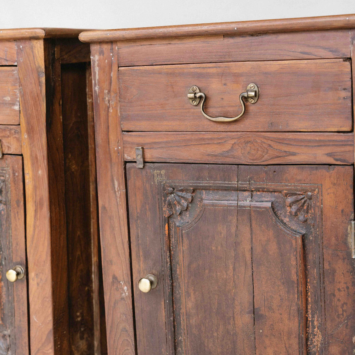 Vintage wooden bedside table from India with one drawer, cupboard and carved timber door, sold separately, exclusive to Brookfield Gardens Brisbane.