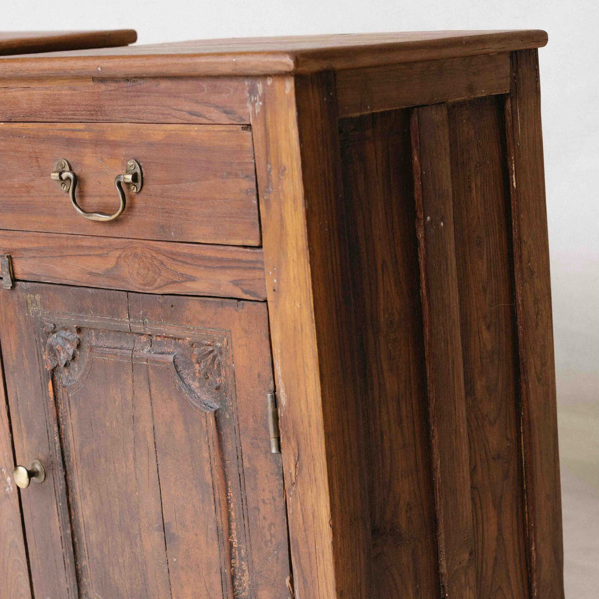 Vintage wooden bedside table from India with one drawer, cupboard and carved timber door, sold separately, exclusive to Brookfield Gardens Brisbane.