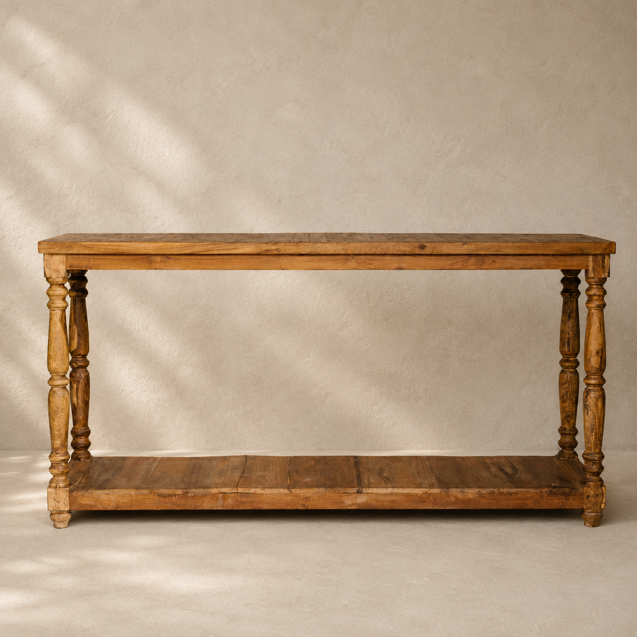 Indian wooden console table with turned legs, natural timber finish and full-length lower shelf.