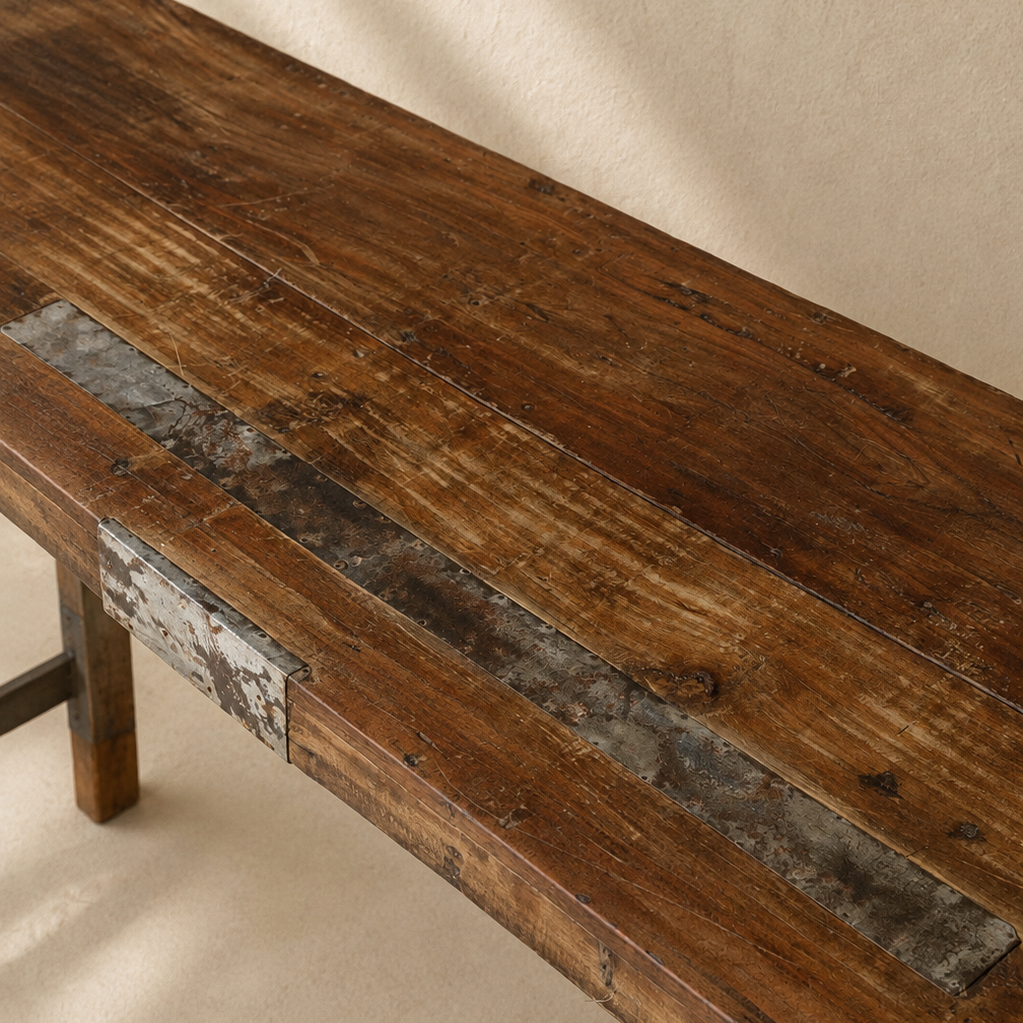 Long Indian wooden table with folding legs, aged timber top and rustic metal detailing, exclusive to Brookfield Gardens.