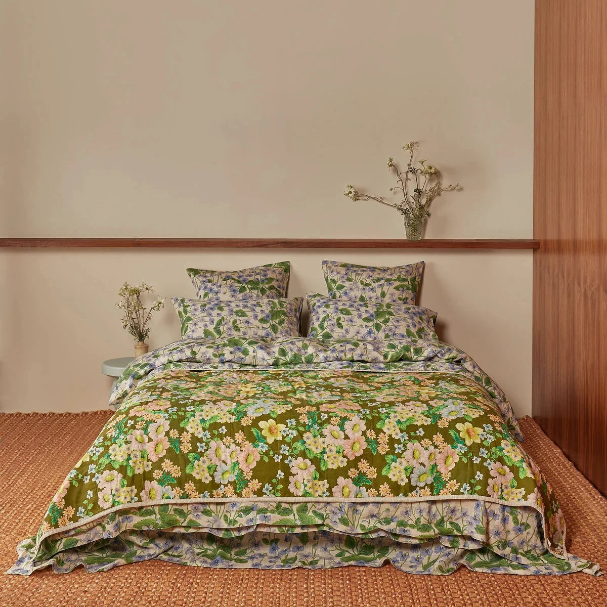 Bonnie & Neil Buttercup Olive & Lilas Blue reversible linen quilted throw featuring botanical floral prints in olive green and blue.