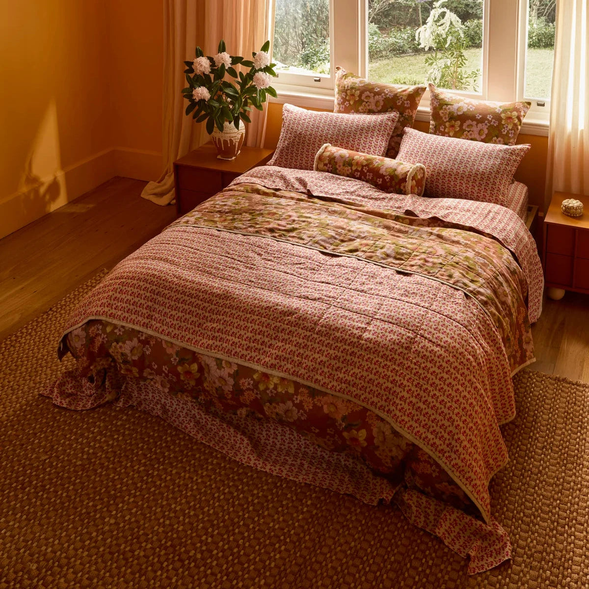 Bonnie & Neil Buttercup Rust & Petit Madeline Pink reversible linen quilted throw featuring warm rust florals and delicate pink botanical patterns.