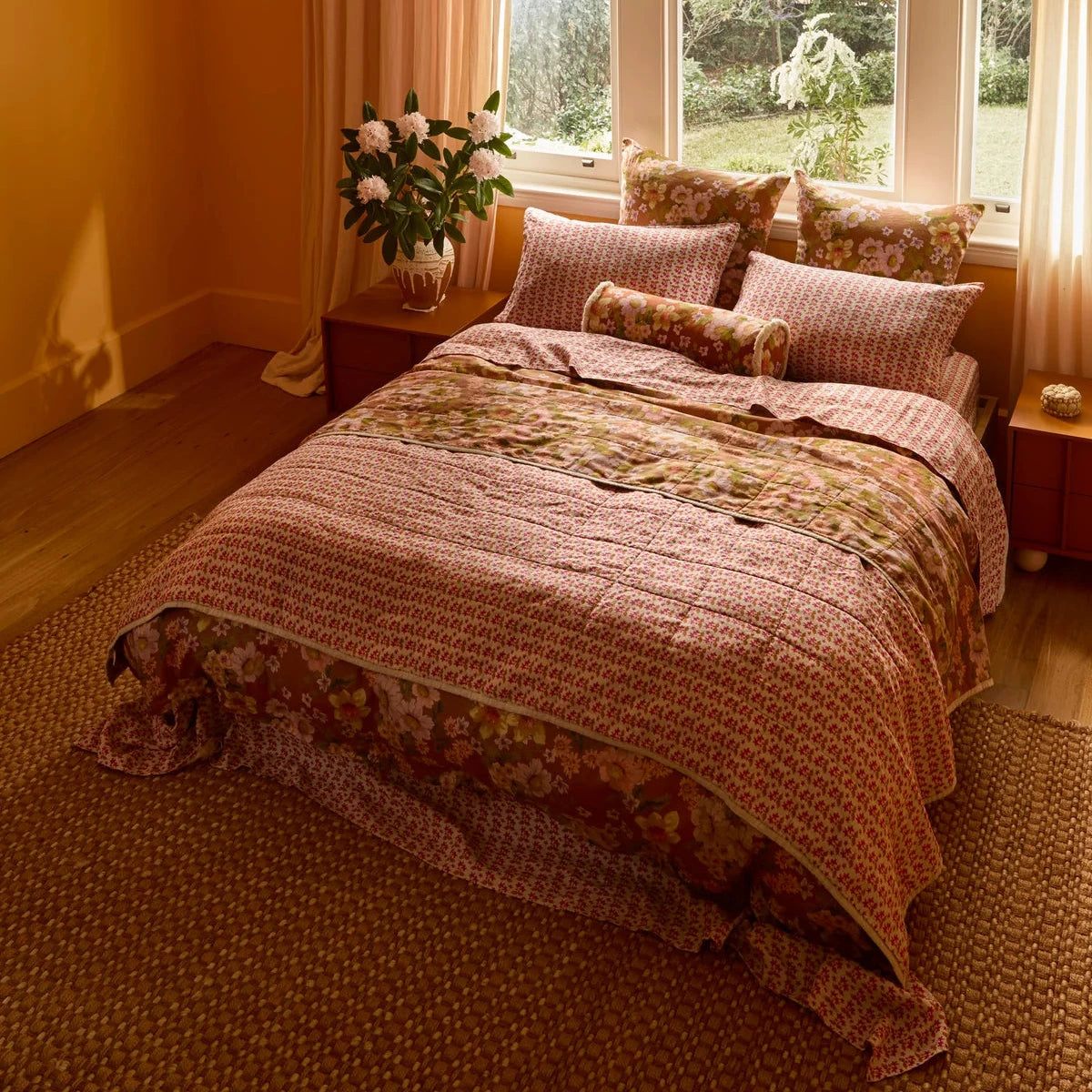 Bonnie & Neil Buttercup Rust standard linen pillowcases featuring colourful buttercup floral artwork on a warm rust background, set of two.