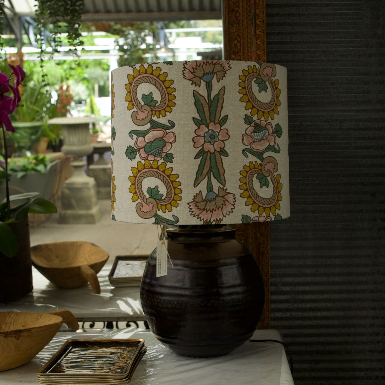 Custom Anna Spiro bronze table lamp with a handmade ceramic base and bespoke floral fabric shade, styled in the Brookfield Gardens homewares collection.