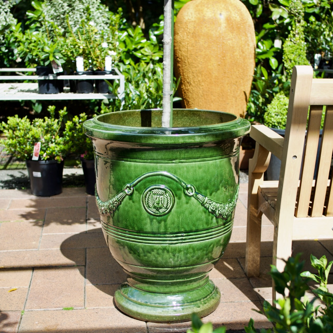 Grand Anduze Urn with a glossy emerald green glaze, styled with a feature tree at Brookfield Gardens, Brisbane.