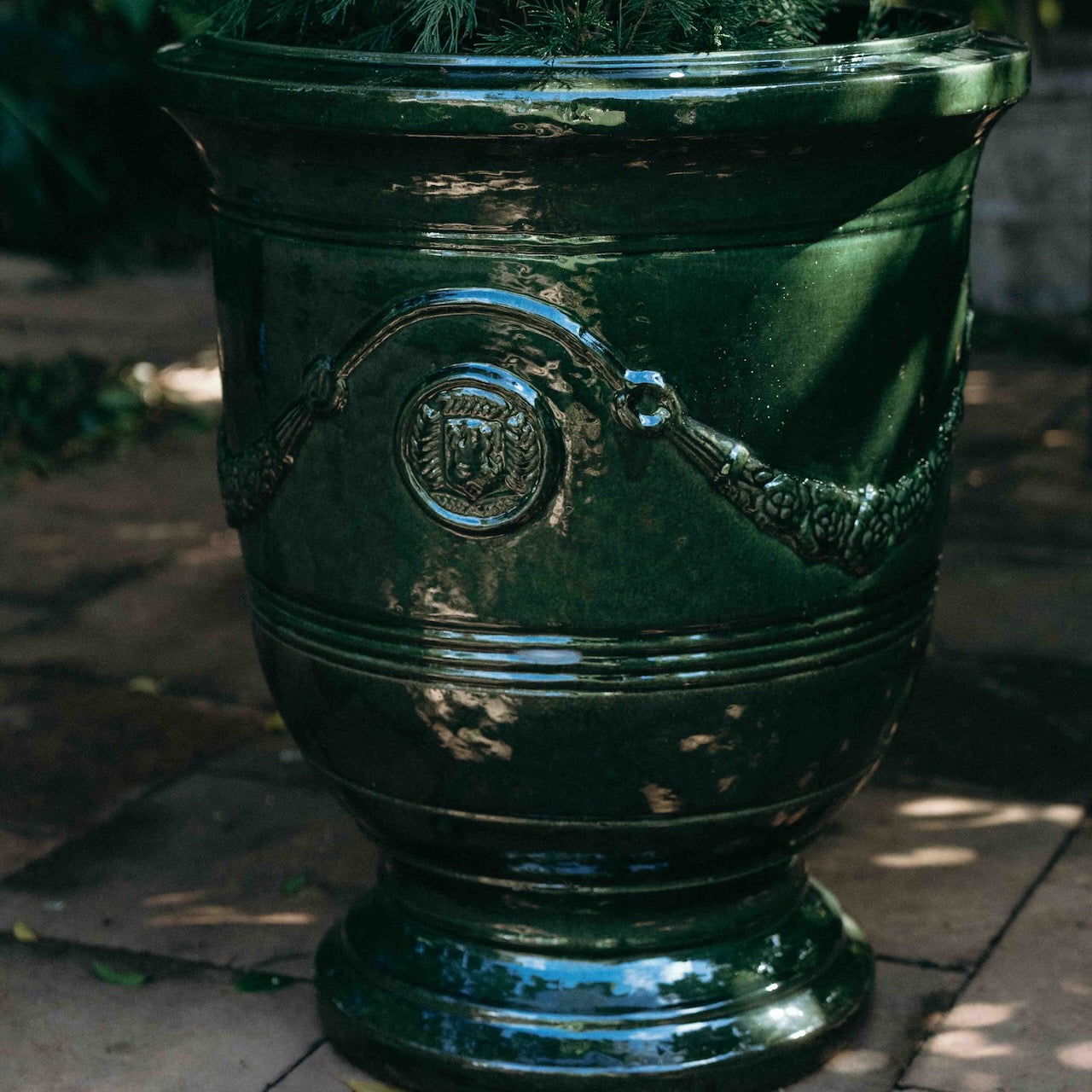 Grand Anduze Urn with a glossy emerald green glaze, styled with a feature tree at Brookfield Gardens, Brisbane.
