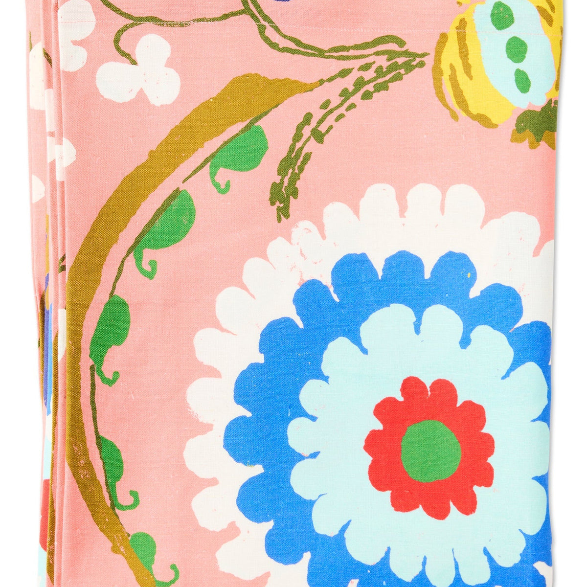 Kip & Co x Anna Spiro Isabelle Sunset Tablecloth featuring oversized multicoloured florals on a coral pink background.