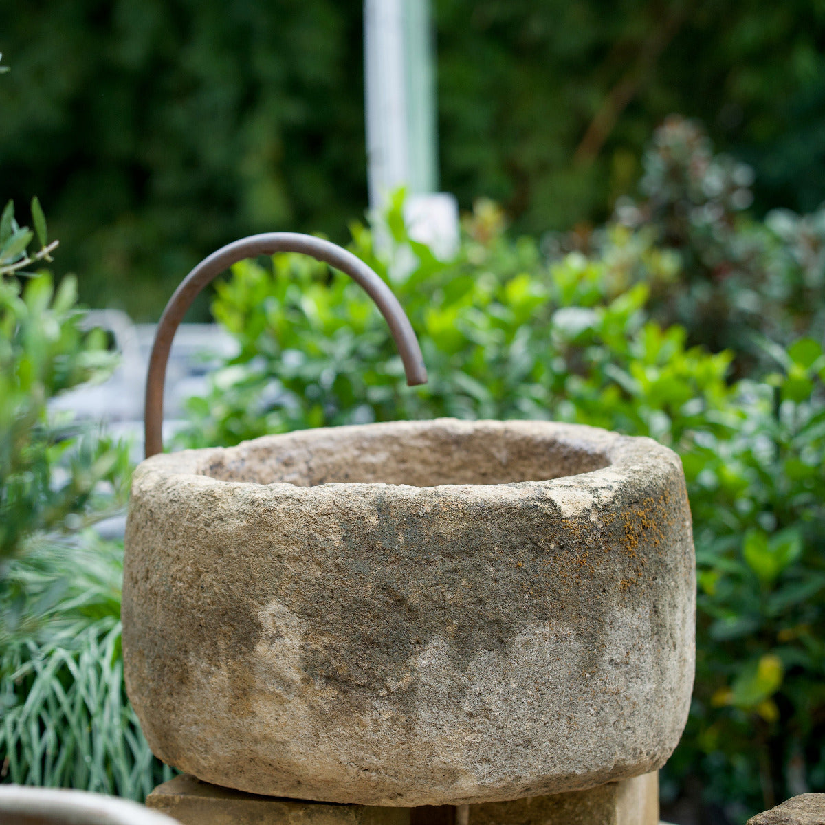 Limestone Pot Round Fountain with aged stone-look texture displayed in garden setting at Brookfield Gardens Brisbane