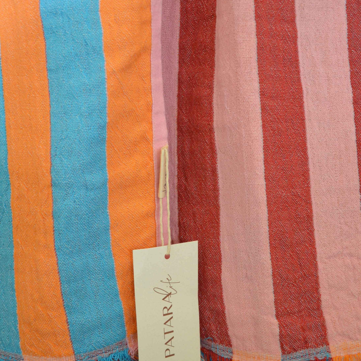 Patara Life Viva Stripe Turkish Beach Towel featuring colourful reversible stripes and fringed edges, made from 100% Turkish cotton.