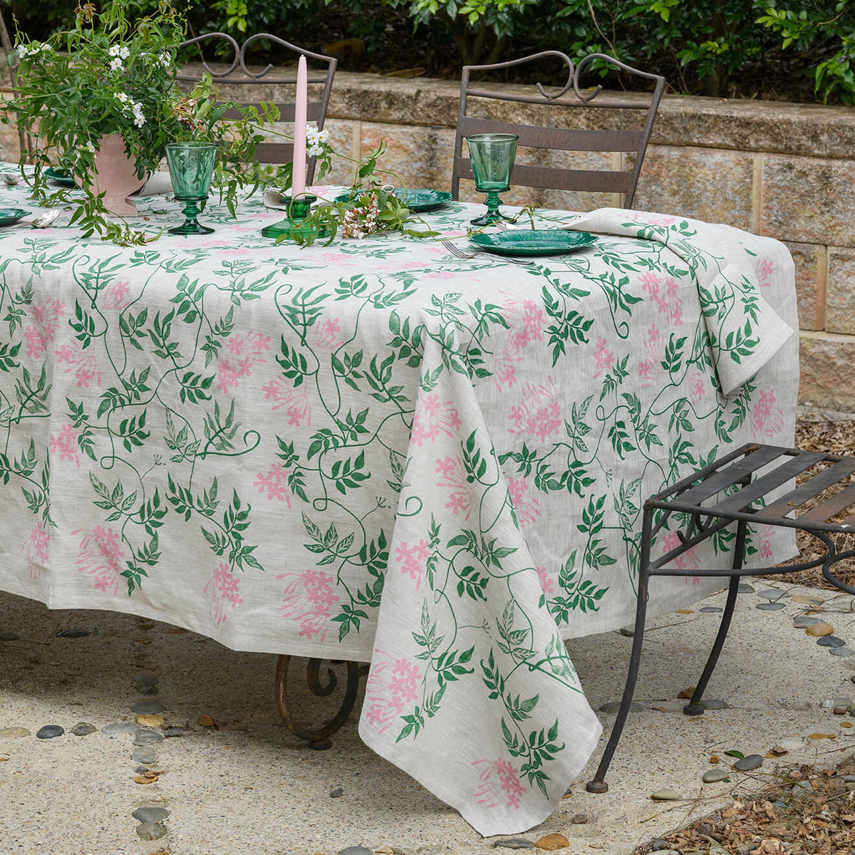 Aqua Door Designs Jasmine linen tablecloth featuring hand screen printed green and pink botanical vines on natural linen, available at Brookfield Gardens Brisbane.