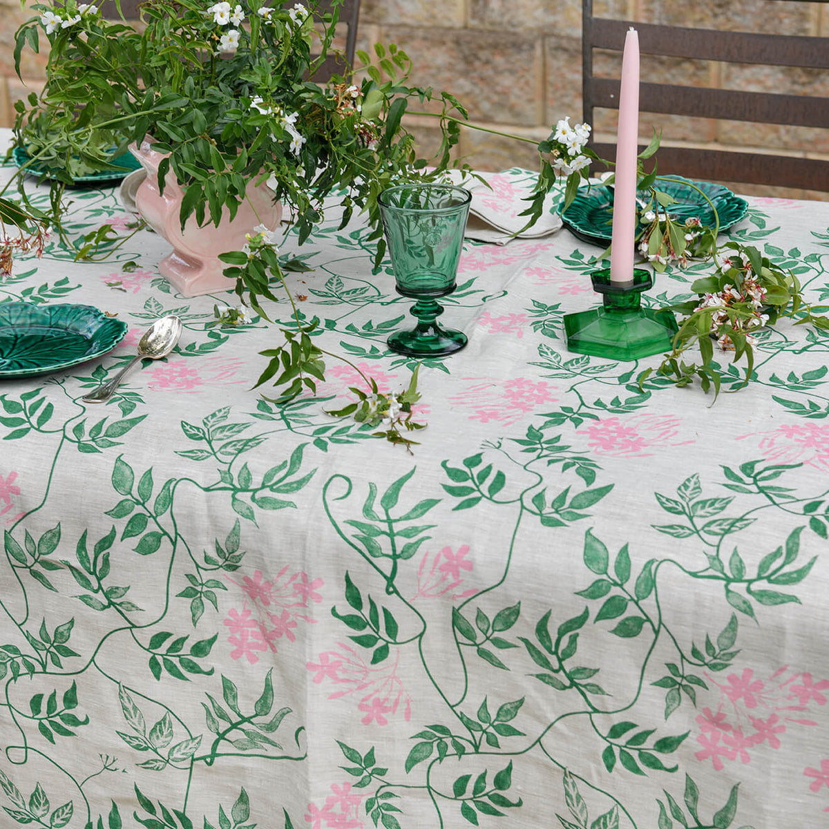 Aqua Door Designs Jasmine linen tablecloth featuring hand screen printed green and pink botanical vines on natural linen, available at Brookfield Gardens Brisbane.