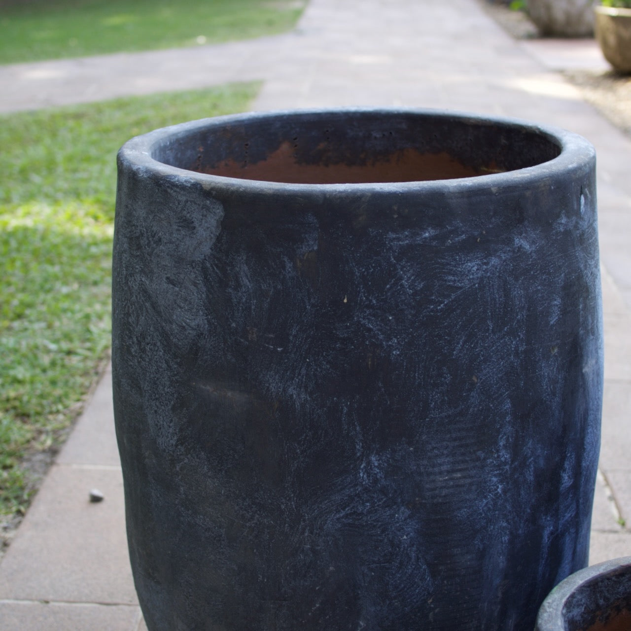 Rustica Black U Planters in multiple sizes with a textured charcoal finish, displayed as contemporary feature pots at Brookfield Gardens, Brisbane.