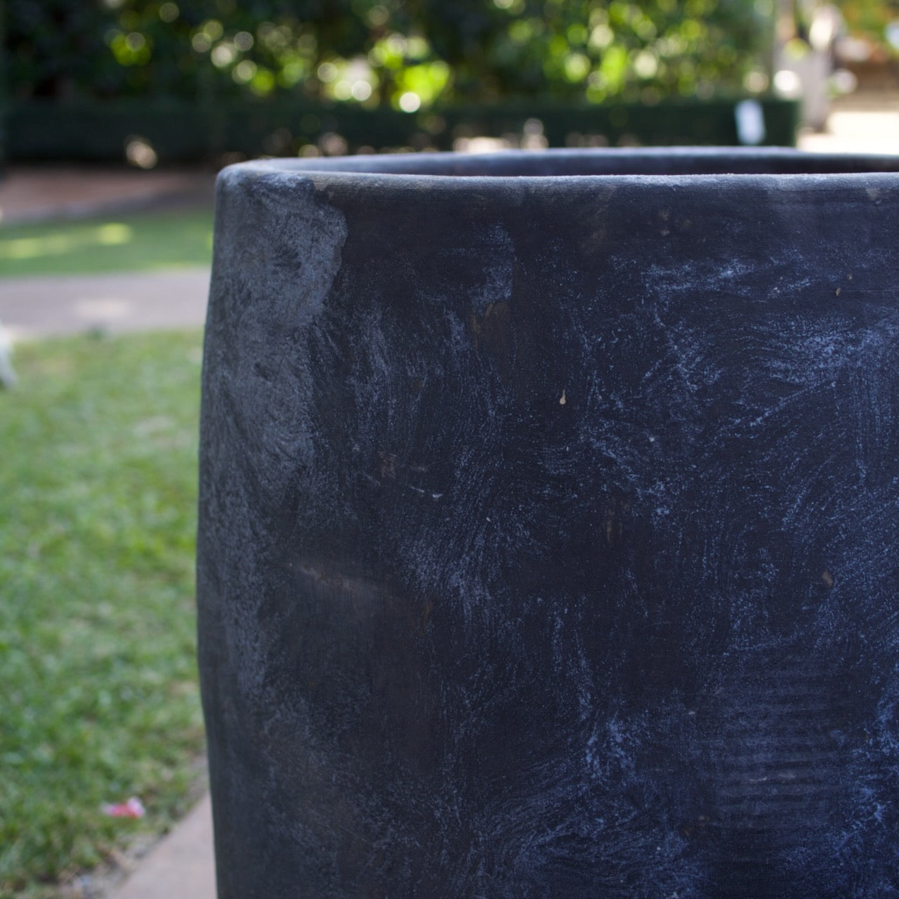 Rustica Black U Planters in multiple sizes with a textured charcoal finish, displayed as contemporary feature pots at Brookfield Gardens, Brisbane.