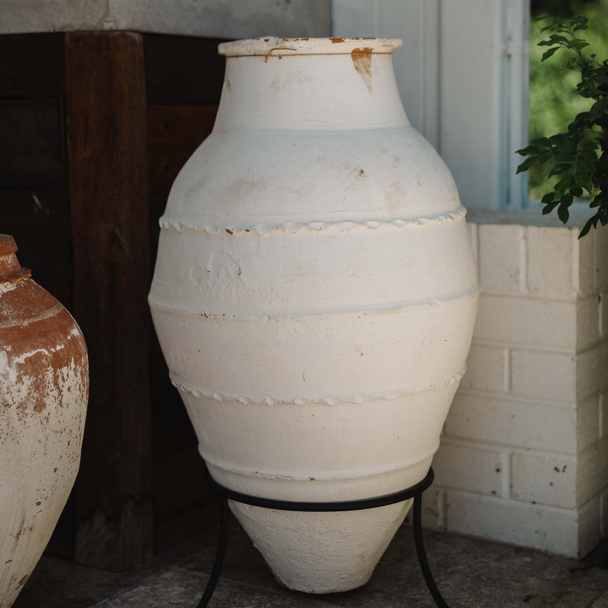 Large Turkish Odemis terracotta pot with classic rounded form and weathered finish, styled for architectural garden spaces.