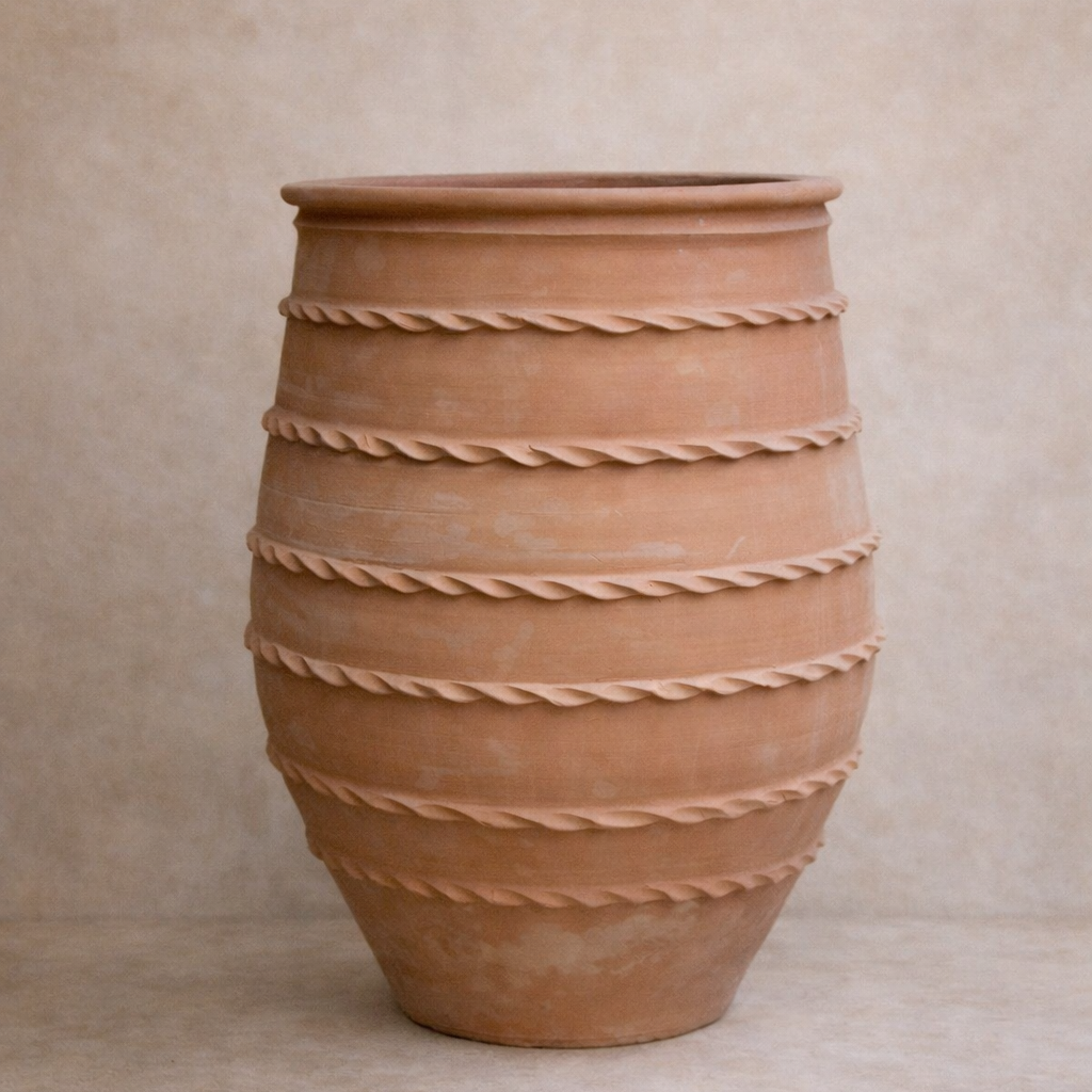 Large Turkish terracotta open mouth garden pot with hand-applied banding, styled against limewashed wall at Brookfield Gardens Brisbane.