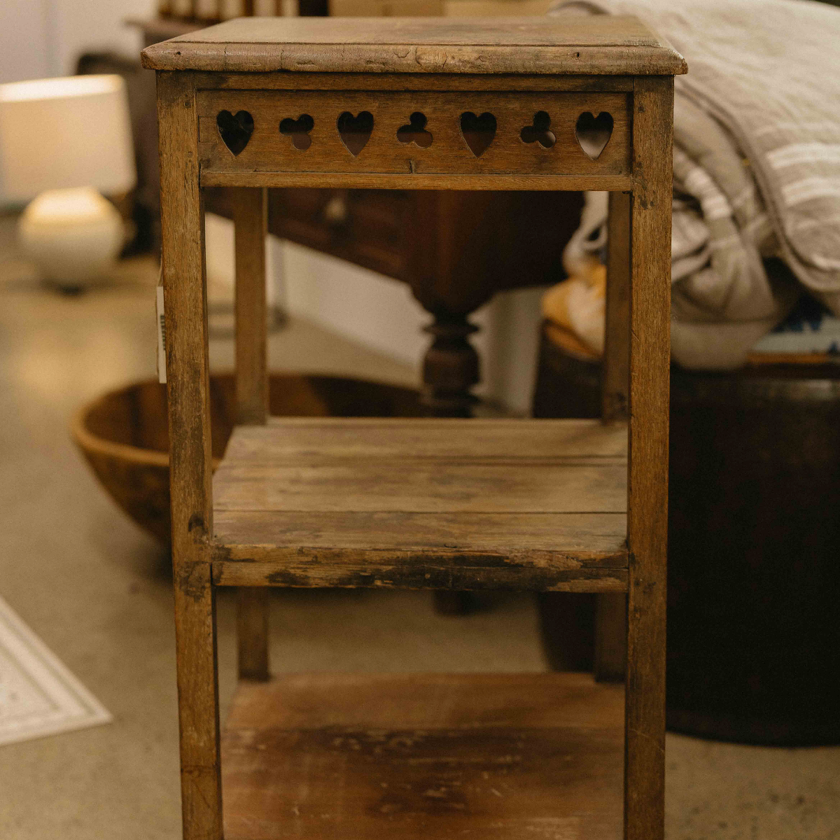 Vintage Indian three-tier wooden side table with decorative heart cut-outs and aged timber finish. Exclusive to Brookfield Gardens.