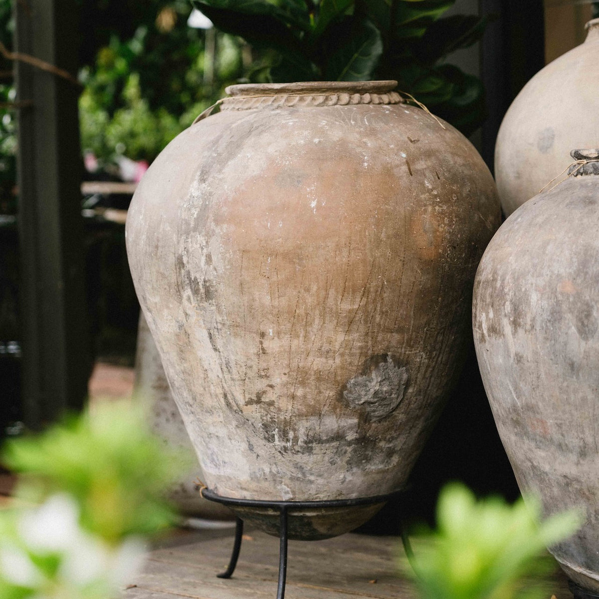 Large vintage Indian terracotta urn with rounded form, decorative rim and naturally weathered earthy finish, exclusive to Brookfield Gardens.