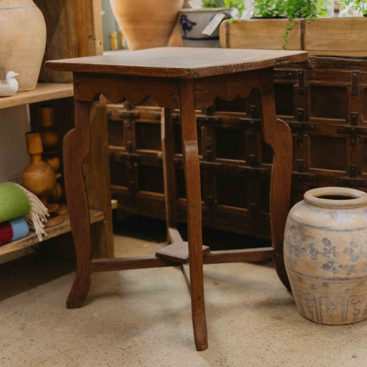 Vintage Indian wooden side table with curved legs, decorative apron and aged natural timber finish. Exclusive to Brookfield Gardens.
